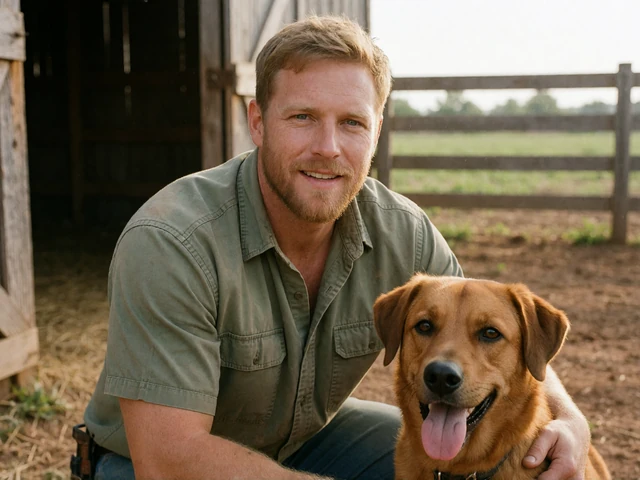 Man farmer smiling beside a dog near a barn for a profile photo.